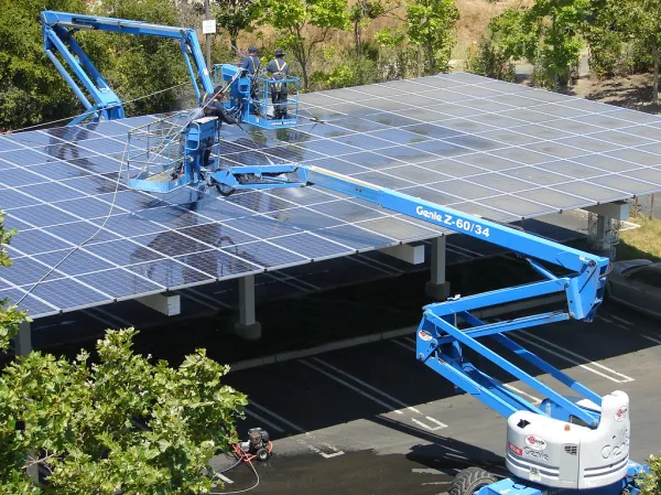 Solar panels above a parking area, illustrating clean energy